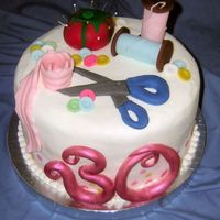 30Th Birthday Crafty Cake 10" triple chocolate layer and 10" vanilla layer filled and iced with buttercream. All decorations made with fondant. This was...