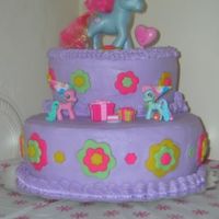 My Little Pony Birthday Cake 8" and 10" chocolate cake filled and frosted in purple buttercream. Fondant decorations and real ponies so the birthday girl...