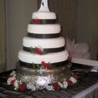 Wedding Cake 4 Tier Wedding cake that I made for my sisters wedding. 16" German Chocolate, 13" Confetti, 10" Butter White, 7" Red...