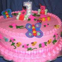 Bugs Birthday Cake 1st birthday cake. 12" Springfetti filled and iced with pink buttercream. All decorations are made with fondant.