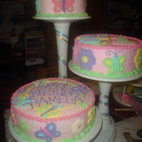 Flowers And Butterflies 1st birthday butterfly and flower cake in buttercream.