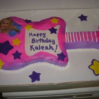 Hannah Montana Guitar Hannah Montana themed guitar carved from a 13x9. Covered with buttercream.