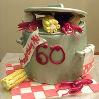 Ragin Cajun Birthday Cake WASC with BC covered in fondant. Gumpaste lid, handles and crawfish. Fondant corn and potatoes.