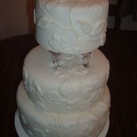 Fondant Wedding Cake My first time working with fondant. I was practicing. Inspiration came from a picture found in a magazine.