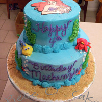 Little Mermaid Birthday Cake 2 tier Stacked white cake with butteceam icing. Flounder and Sebastian figures are my first attempts at fondant sculpting. Ariel on top is...