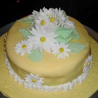 Wilton Course 4 Final Cake Cake is covered with fondant and has gum paste daisies. This was my final cake for Wilton Course 4 - Fondant & Gum Paste.
