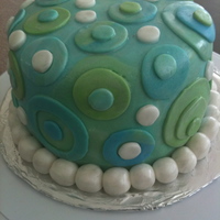 "feeling Blue" Chocolate fudge peanut butter cake and frosting that's covered with fondant.