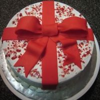 Peppermint Package This is an 8x3in white chocolate cake. I needed something quick and thankfully, this didn't take long at all! Used tip 21 for rosette...