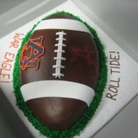 Auburn Vs. Alabama Football Cake I made this for an Iron Bowl party. Grass is bc, football is chocolate fudge and fondant school logos.