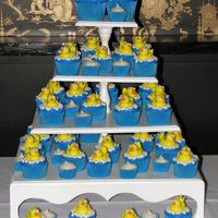 Tower Of Duckies Instead of a Grooms Cake, the couple opted for cupcakes. And the bride and groom gave each other rubber duckies through out their courtship...