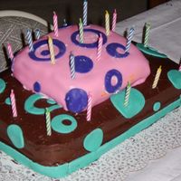 Birthday Cake For Me And My Sister. Top is fondant bottom is butter cream, circles are fondant. I still need more practice but it's fun learning.