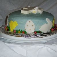Easter Cake I made this cake with blue crusting cream cheese frosting and fondant accents. The cross is made of chocolate and I bought the flowers. I...