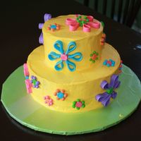 Flower Birthday Cake A joint effort between me and my cousin-in-law (is that a real word?). She did all the baking and icing making and then I helped her...