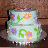 Flowers Flower cake for a 7 yr old girl who only said she wanted blue, purple, and green. The rest was up to me and her mom. Done with inspiration...