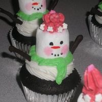 Snowman.jpg My Cute little snownmen and women. The arms are melted chocolate chips piped out. These are a hoot to make !! Thanks CC