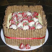 Strawberry's And Chocolate This was made for a friends going away party at work. It's strawberry cake with white chocolate icing and fresh dipped and swirled...