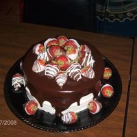 Marty's 61 this was the nicer cake since the other one was crappy. This is a chocolatecake with strawberry filling, buttercreme icing topped with...