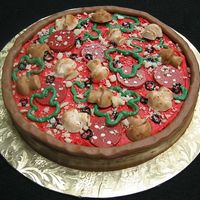 Pizza Amore White Cake iced w/ Chocolate Buttercream. Pizza toppings are made of chocolate.