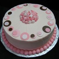 Polka Pinks Ii White raspberry cake iced in buttercream w/ fondant accents