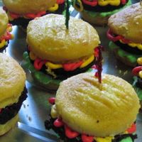Hamburger Cupcakes Yellow cake "buns" with brownie "burgers". SMBC "ketchup, mustard, and lettuce".