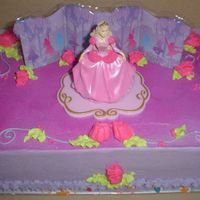 First Barbie Cake Chocolate cake with chocolate mousse - purchased my first licensed cake topper. Copied cake pictures they supply, wasn't as...