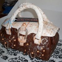 Purse Cake My first handbag/purse cake, all chocolate with choc ganash, fondant details TFL