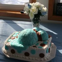 Pregnant Belly Cake Bettercreme frosting in the bottom cake with mmf accents. Ganache was used on the 'belly' cake and covered in mmf.