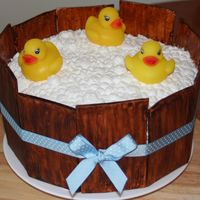 Rubber Duck Shower Cake Bettercream frosting for the bubbles, fondant board, rubber ducks on top.