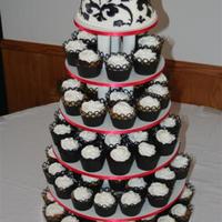Black And White Cupcakes With Damask Topper This cake was frosted with buttercream, as were all of the cupcakes. I used the Cricut to cut out all of the cupcake wrappers as well as...