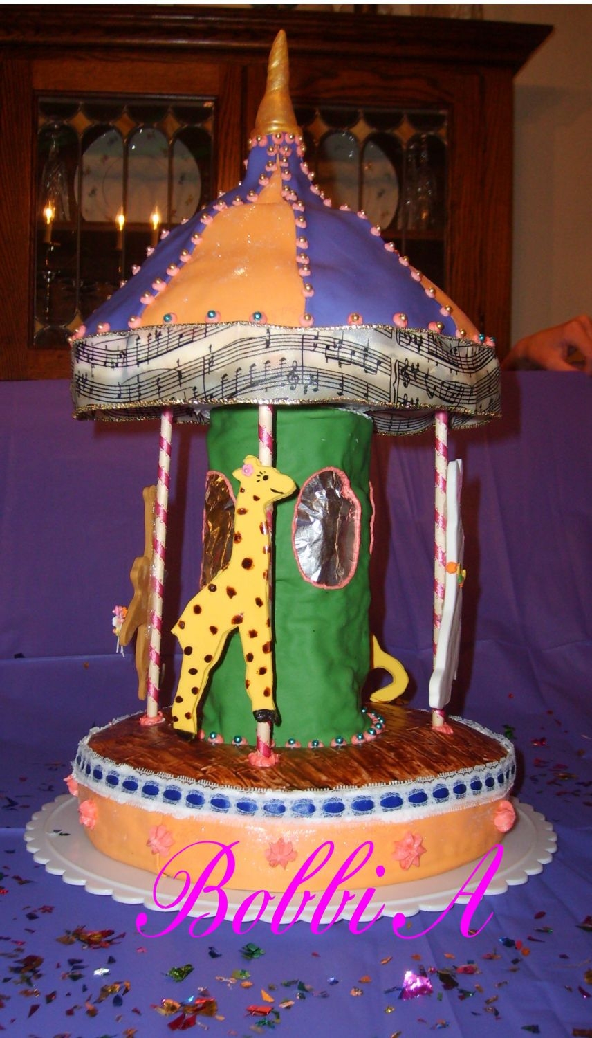 Carousel Birthday cake for a first birthday and a 13th birthday. Fondant animals, marble confetti cakes covered in fondant.