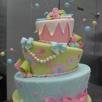 Flower Fun 6,9,12" layers covered in fondant with fondant accents. Inspired by DD's dress.