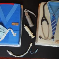 Doctors Farewell 2 9x13 cakes covered in fondant made for anesthesia doctors farewell party. all accents and instruments are fondant/gumpaste. everything is...