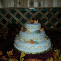 Fall Wedding Bride and groom wanted a fall theme, leaves and pumpkins made from fondant.