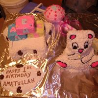 First Birthday Cake Mom and Dad had a theme going, daughter's first birthday very special. Bears, Blocks and Rattle - all cake except the bar connecting...