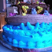 Noah's Ark Bottom two layers are cake with B.C. and top is chocolate cookie. Animals are royal icing.