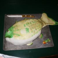 Fish Cake For My Brother My brother loves EVERYTHING hunting and fishing so I suprised him with this cake...It is a chocolate cake with MMF, the knife and lure are...