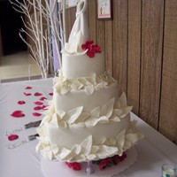 Heart Shaped With Leaves Fondant covered heart shaped wedding cake. Gum paste leaves sprinkled with gliltter