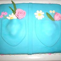 Jean Pocket Cake With Flowers This was my first fondant cake. I used gum paste for the roses, daisies, and leaves. I used Royal icing on everything else except the blue...