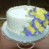 Pansy Flower Basket Small oval cake with fondant/gum paste pansies and buttercream basketweave. I made this for the cake walk at the annual school carnival.