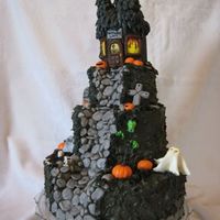 H'ween Cake #1 My son's sixth birthday cake. all the layers are chocolate cake with peanut butter mousse filling, it's covered in chocolate...