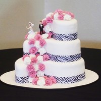 Paisley Shaped Wedding Cake Bride wanted a tall cake, but not too much cake - so each layer has a foam lift to make it a little taller.. Handmade gumpaste carnations...