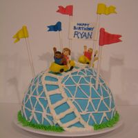 Rollercoaster This is from the Wilton web site, but I did my people, rollercoaster cars, and flags/sign in MMF. I also did not cover the cake in fondant...