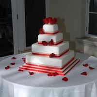 Red Wedding Fondant with satin ribbon and royal icing "dots". Thanks for looking.