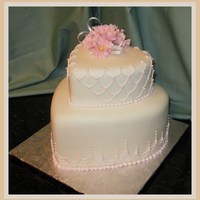 Hearts And Strings Fondant, royal string work and gumpaste flowers.