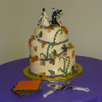 Fall Fairy Wedding Cake topsy turvy cake with buttercream icing and fondant accents.