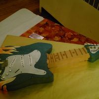 Electric Guitar the bride said he played the guitar and thought it would be cool. it turned out better than i thought it would!! he loved it so much he...