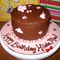 Mischievous Pink Puppies Cake for my niece's 3rd birthday. She LOVES chocolate cake, puppies and the color pink, so I made pink puppies and bone from fondant,...