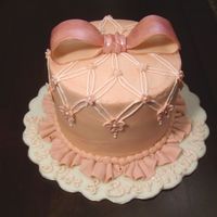 Sugar & Spice Buttercream with fondant bow, ruffle border and flowers. Royal Icing letters.