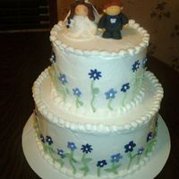 Purple Bridal Shower The cake is a 6" and 9" and the bride and groom are made of fondant.