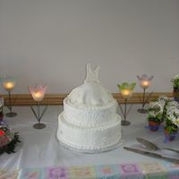 Wedding Gown Cake I made this cake for my sister in laws bridal shower. The cake was white with strawberry filling. No one wanted to cut the cake... Then...